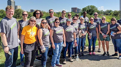Group photo of Grange associates volunteering outside at the Grange Insurance Audubon Center